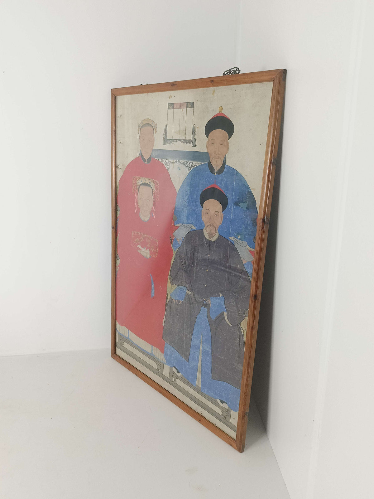 A framed Chinese ancestral portrait is a traditional hand-painted A framed Chinese ancestral portrait is a traditional hand-painted