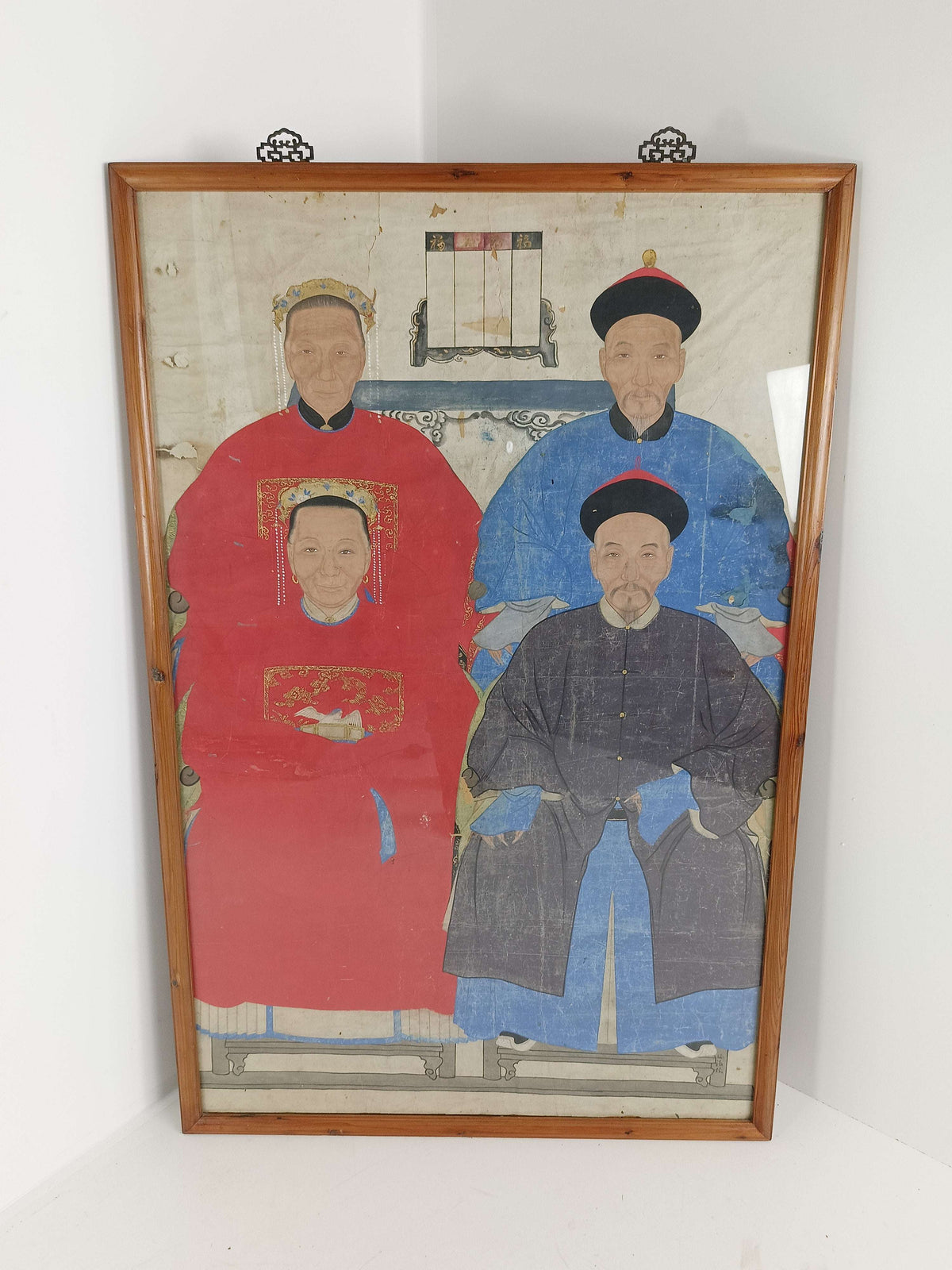 A framed Chinese ancestral portrait is a traditional hand-painted A framed Chinese ancestral portrait is a traditional hand-painted
