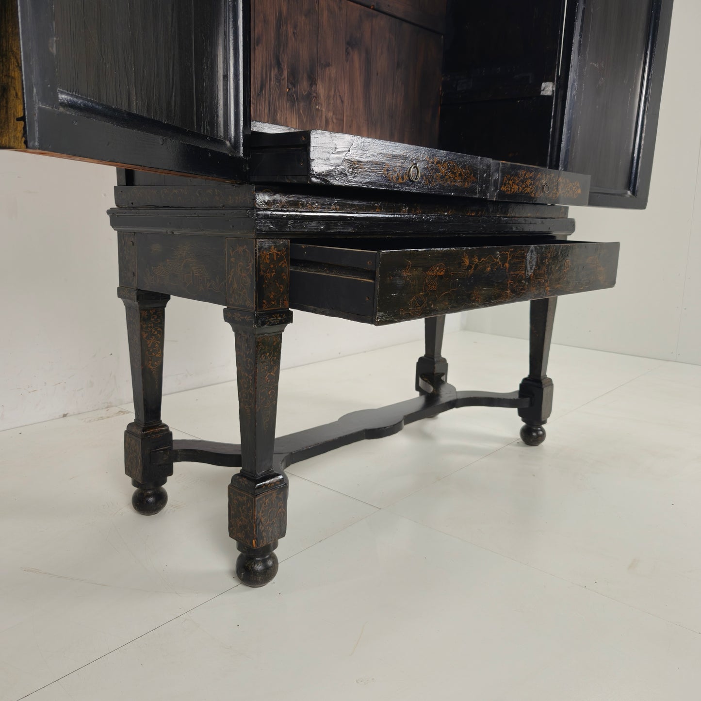 A rare early 18th-century Dutch japanned chinoiserie cabinet, circa 1700