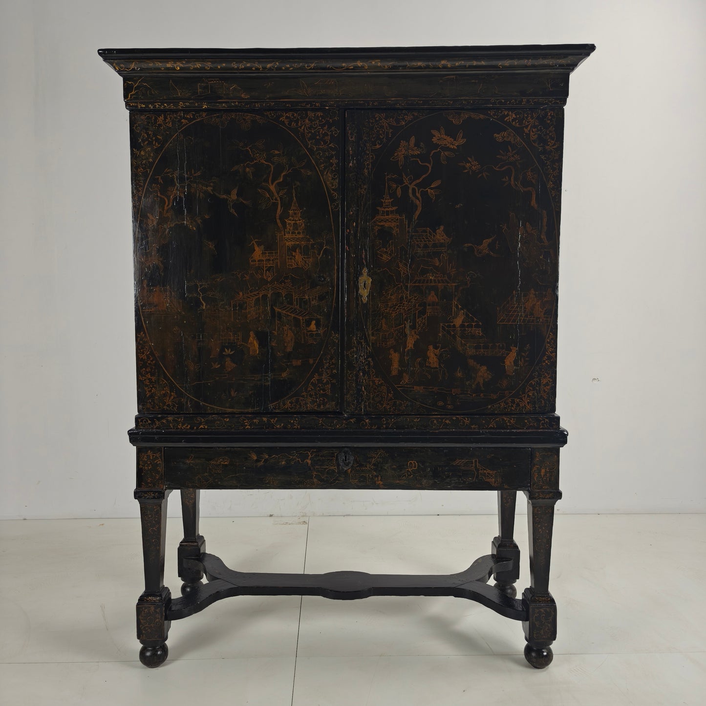 A rare early 18th-century Dutch japanned chinoiserie cabinet, circa 1700