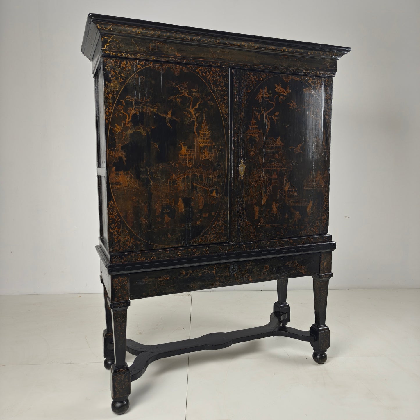 A rare early 18th-century Dutch japanned chinoiserie cabinet, circa 1700