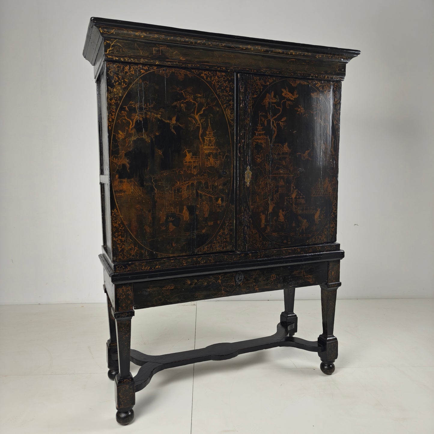 A rare early 18th-century Dutch japanned chinoiserie cabinet, circa 1700