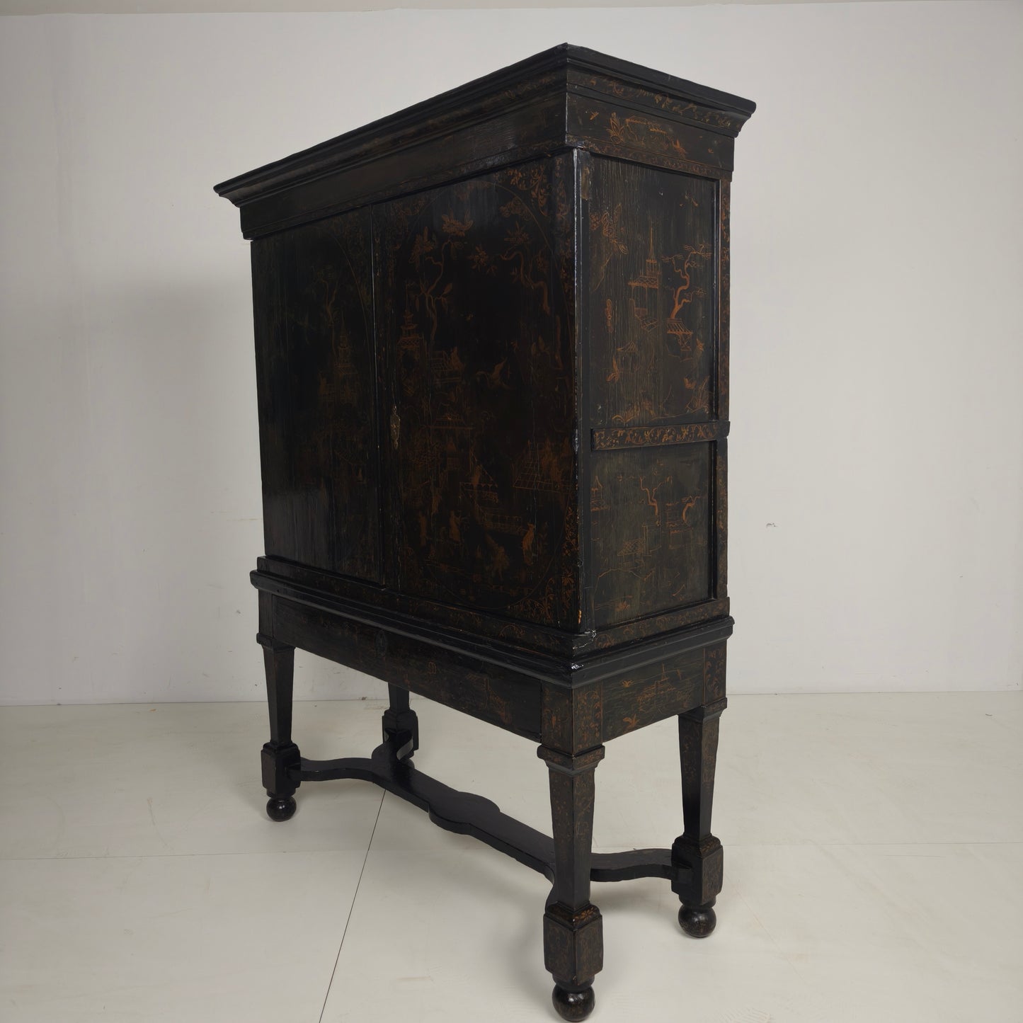 A rare early 18th-century Dutch japanned chinoiserie cabinet, circa 1700