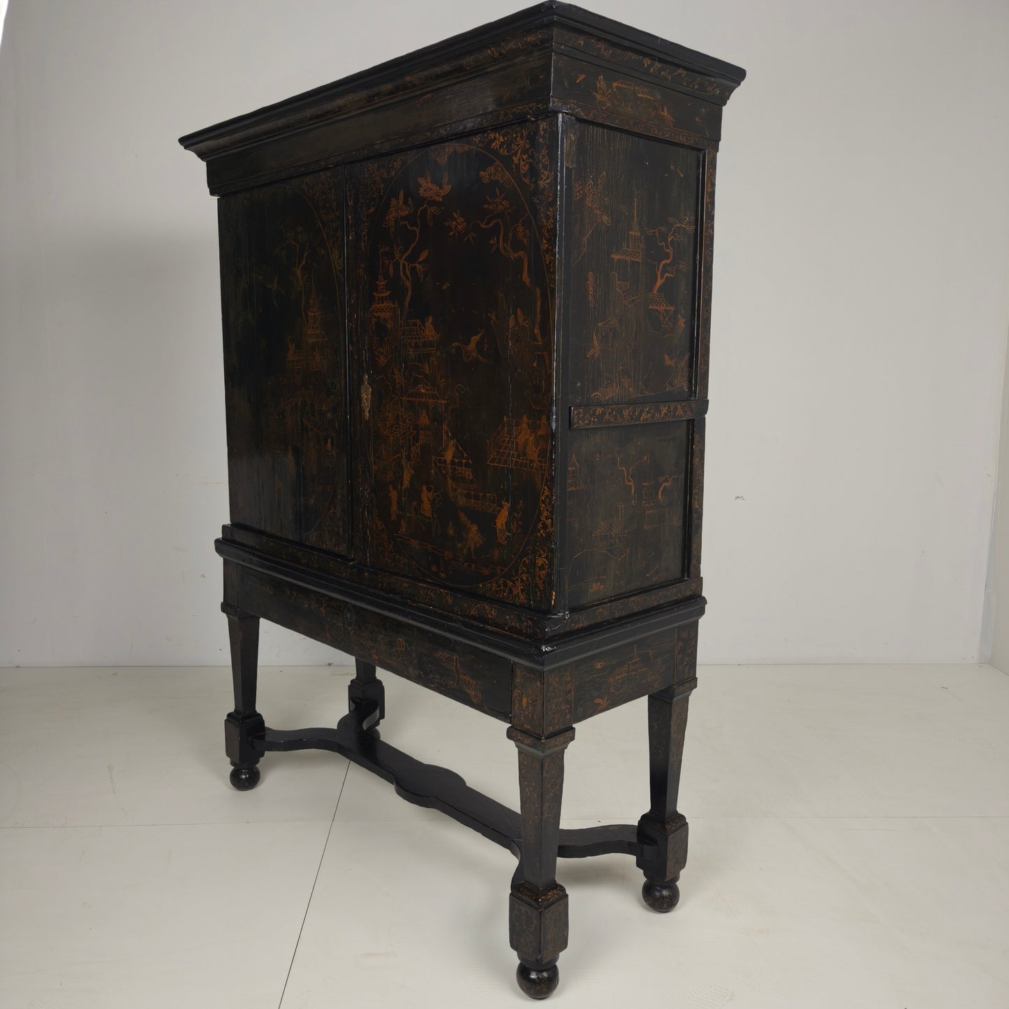 A rare early 18th-century Dutch japanned chinoiserie cabinet, circa 1700
