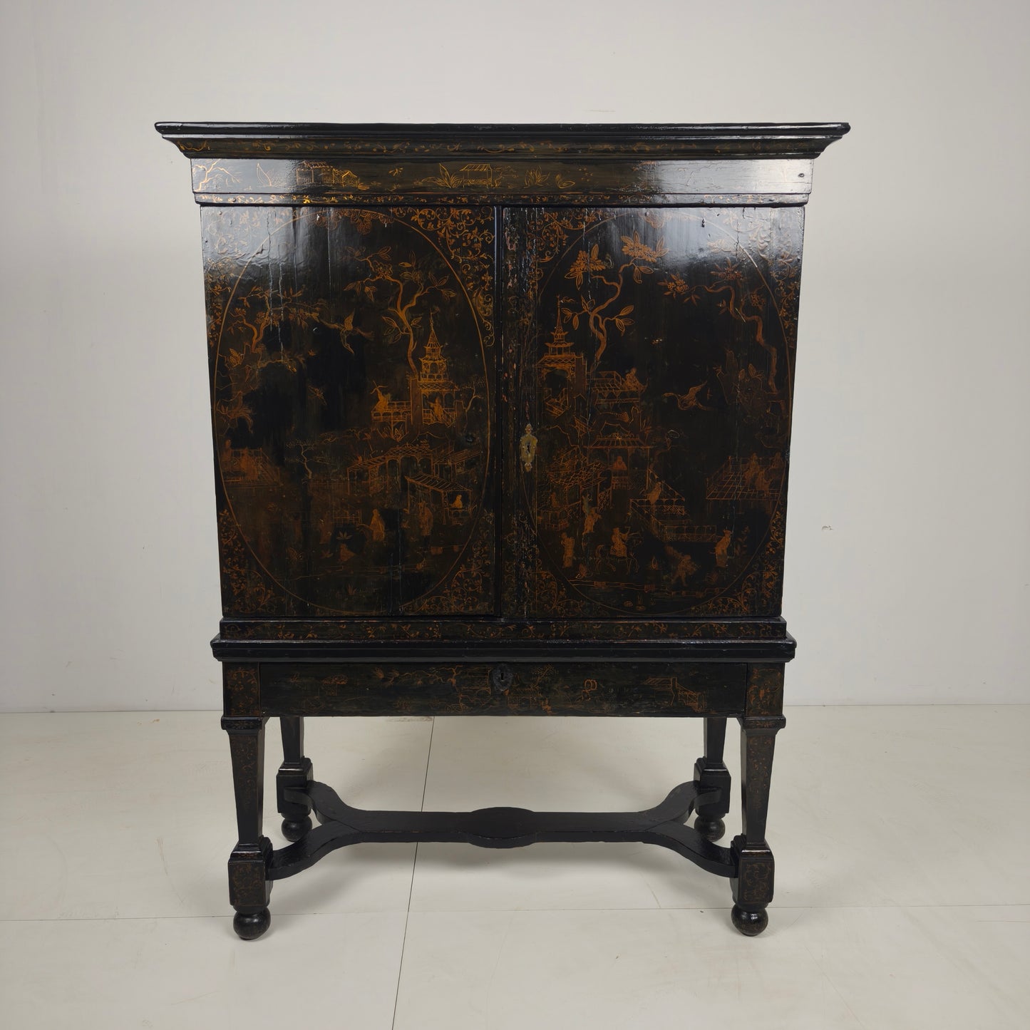 A rare early 18th-century Dutch japanned chinoiserie cabinet, circa 1700
