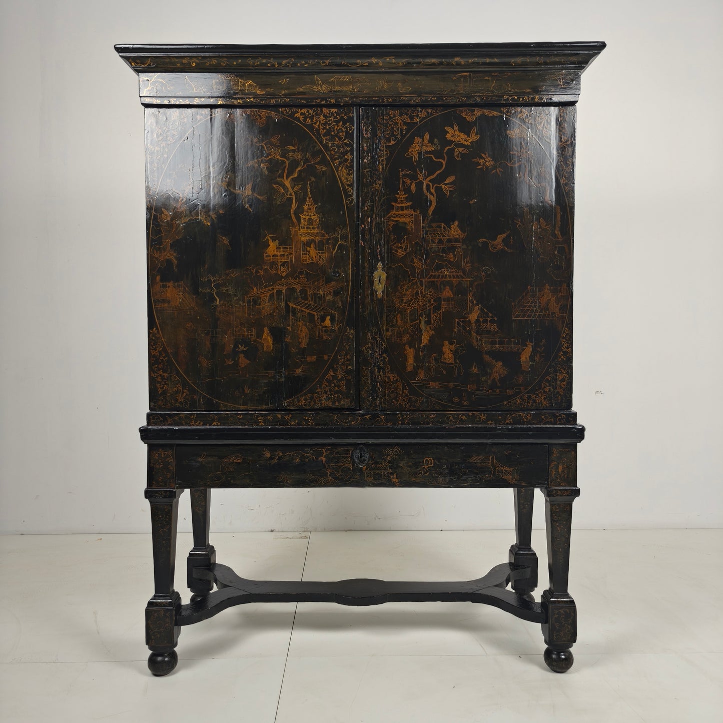 A rare early 18th-century Dutch japanned chinoiserie cabinet, circa 1700