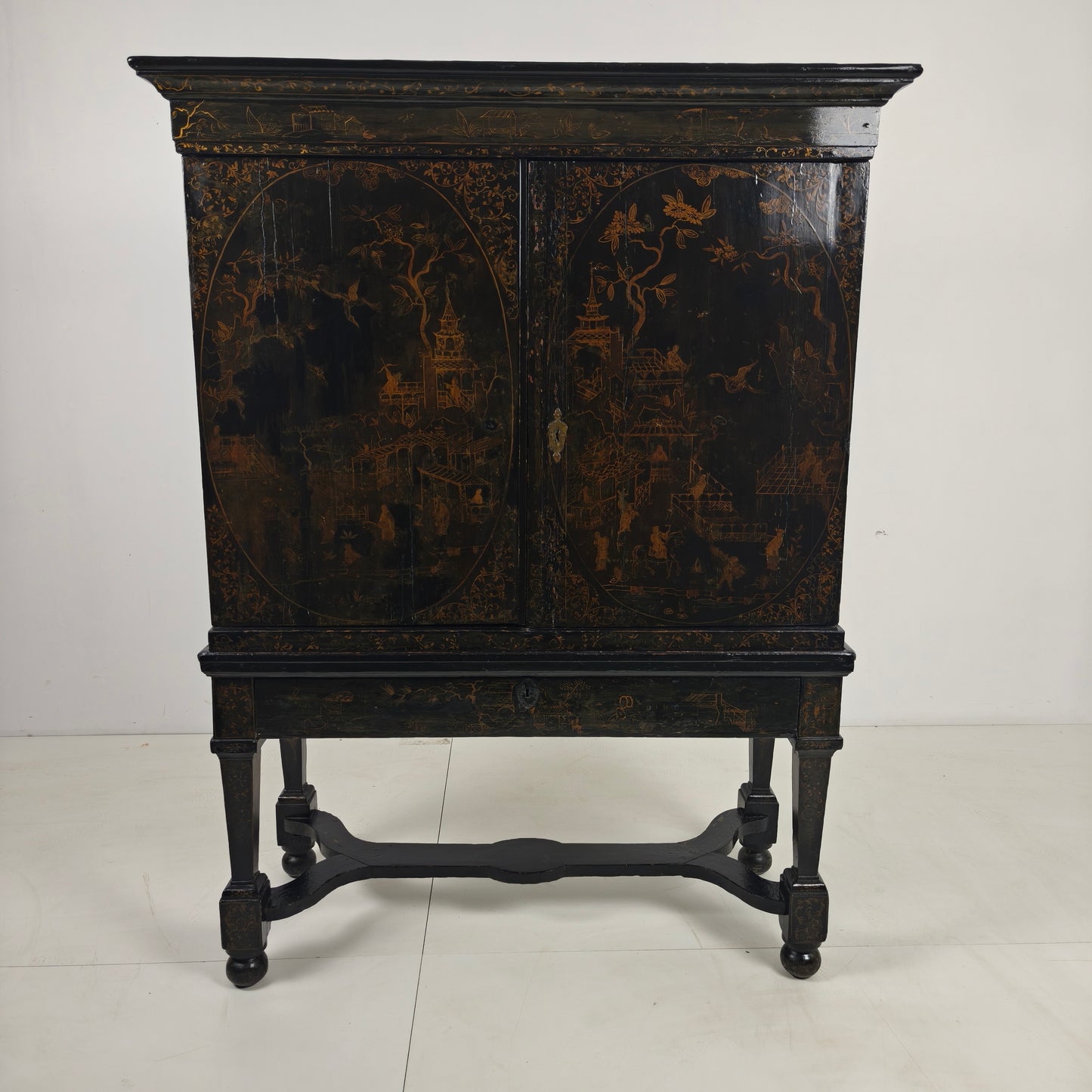A rare early 18th-century Dutch japanned chinoiserie cabinet, circa 1700