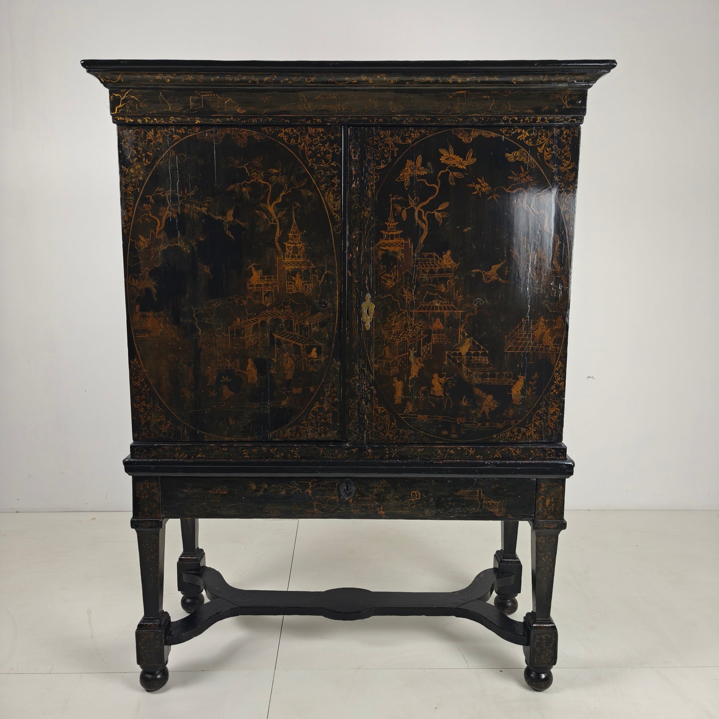 A rare early 18th-century Dutch japanned chinoiserie cabinet, circa 1700