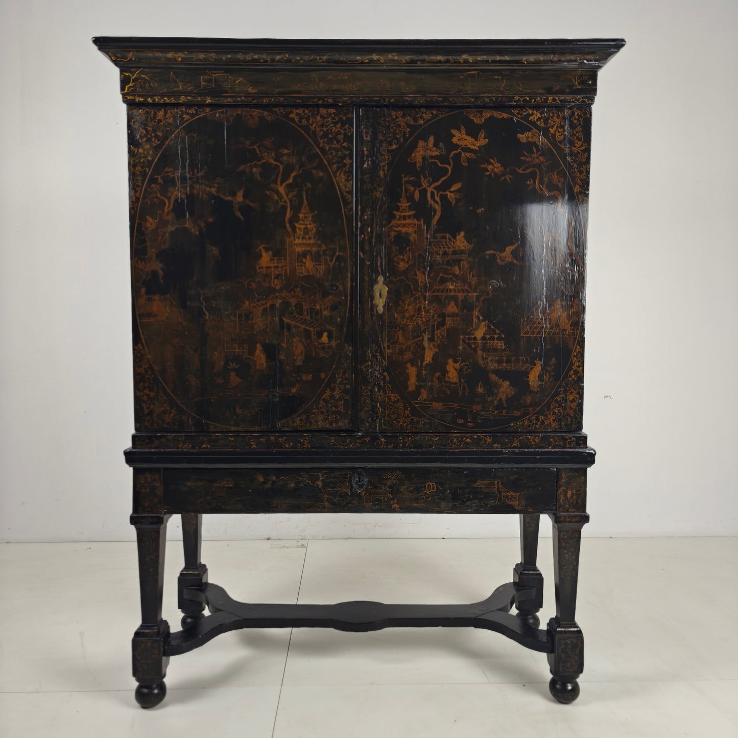 A rare early 18th-century Dutch japanned chinoiserie cabinet, circa 1700