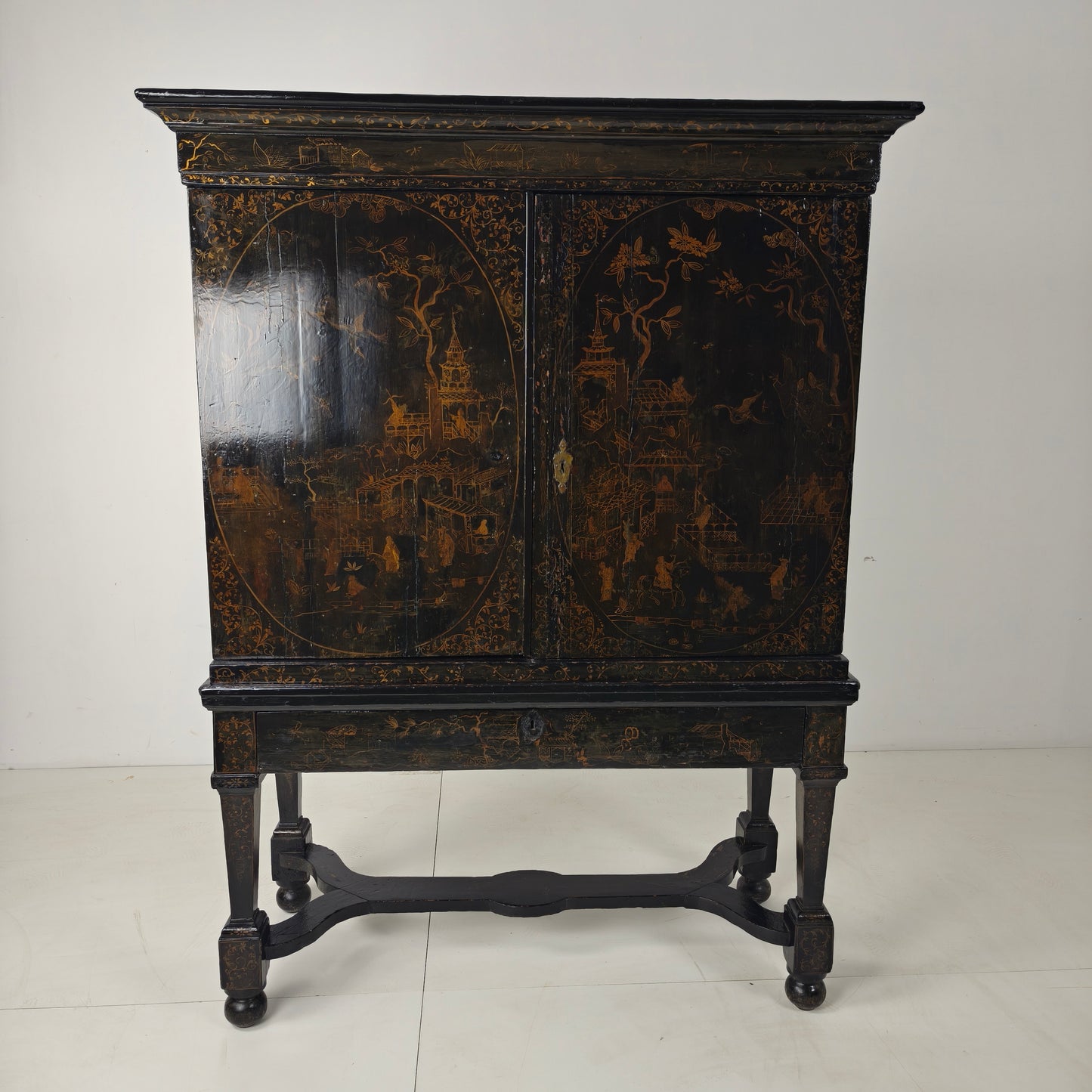 A rare early 18th-century Dutch japanned chinoiserie cabinet, circa 1700