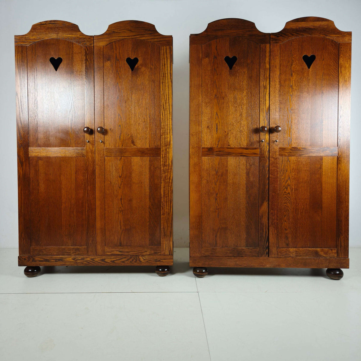 Pair of Belgian Oak Wardrobes with Heart Motif, 20th Century Pair of Belgian Oak Wardrobes with Heart Motif, 20th Century