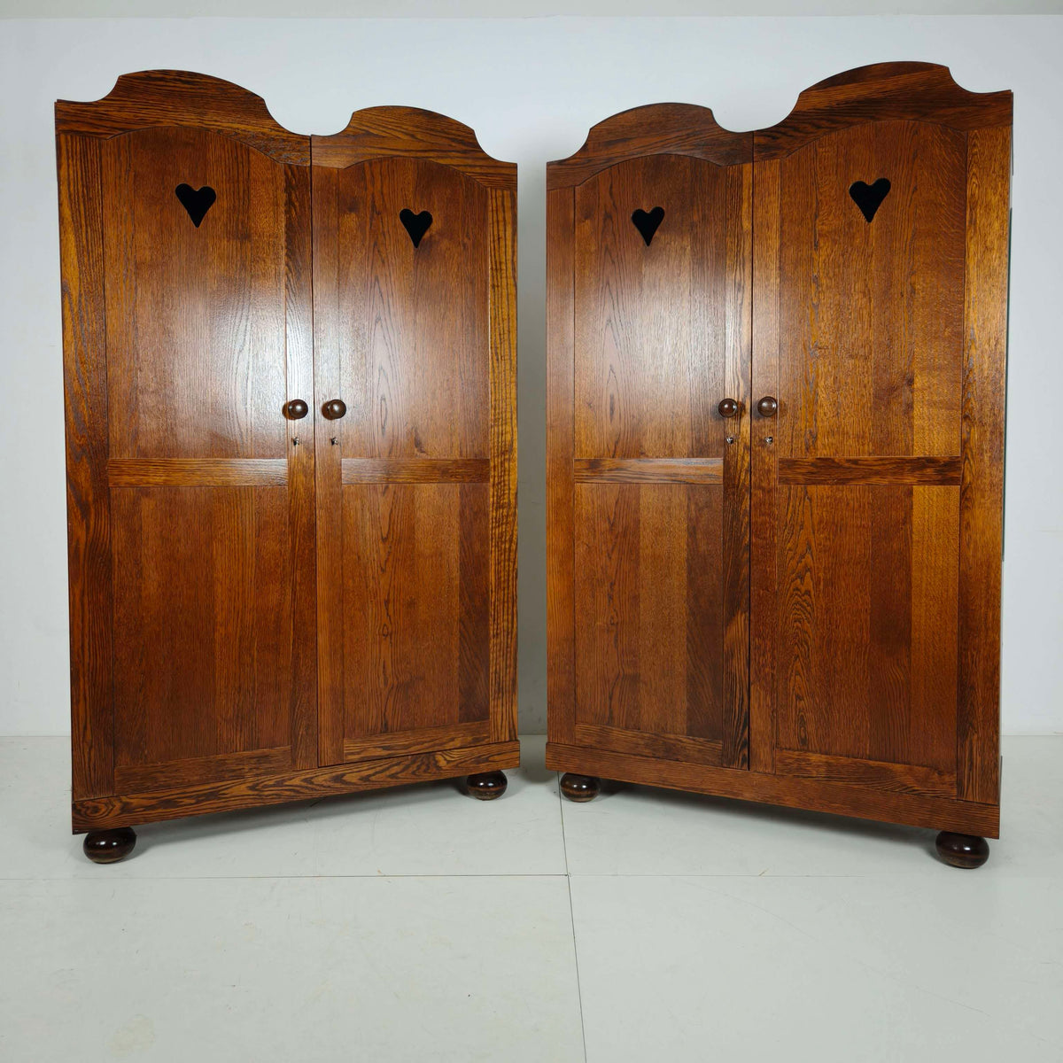 Pair of Belgian Oak Wardrobes with Heart Motif, 20th Century Pair of Belgian Oak Wardrobes with Heart Motif, 20th Century