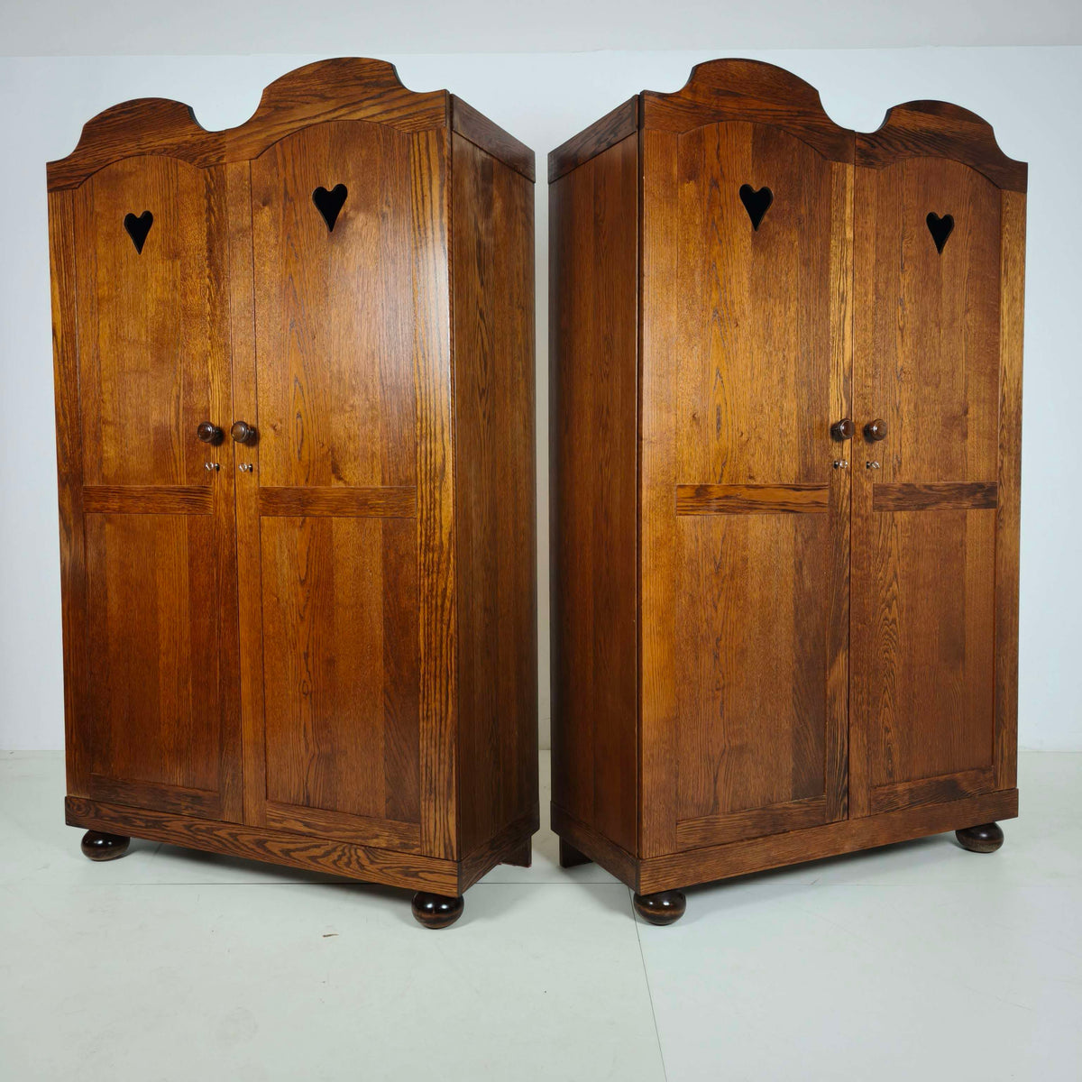 Pair of Belgian Oak Wardrobes with Heart Motif, 20th Century Pair of Belgian Oak Wardrobes with Heart Motif, 20th Century