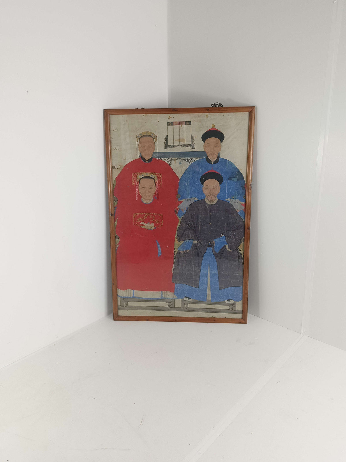 A framed Chinese ancestral portrait is a traditional hand-painted A framed Chinese ancestral portrait is a traditional hand-painted