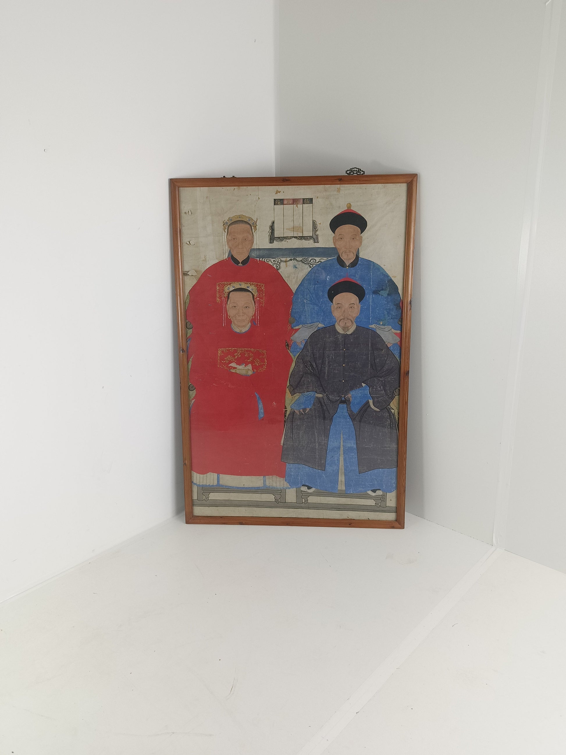 A framed Chinese ancestral portrait is a traditional hand-painted A framed Chinese ancestral portrait is a traditional hand-painted