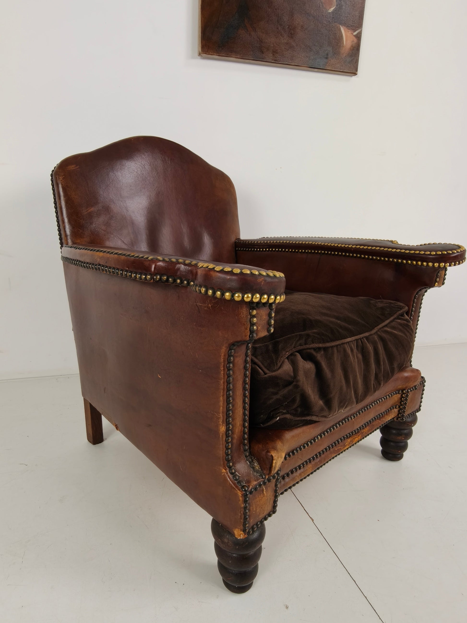 Antique Leather Club Chair with Stud Detailing Antique Leather Club Chair with Stud Detailing