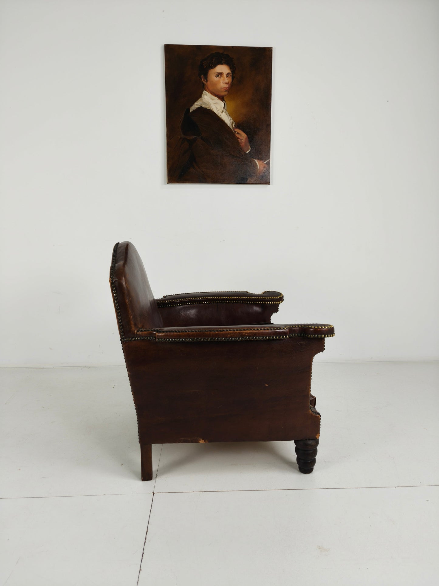 Antique Leather Club Chair with Stud Detailing Antique Leather Club Chair with Stud Detailing