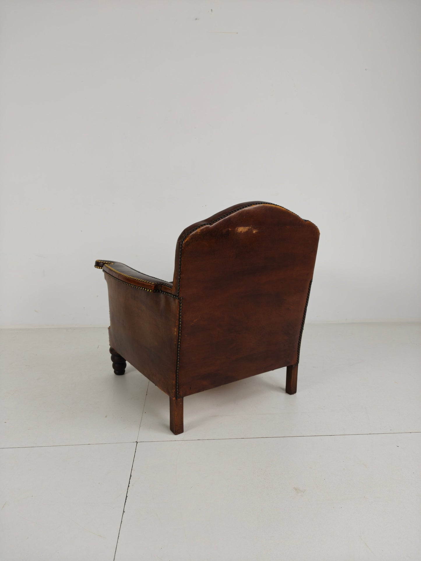 Antique Leather Club Chair with Stud Detailing Antique Leather Club Chair with Stud Detailing